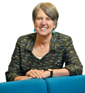 Photo of Christine Padesky leaning on a sofa